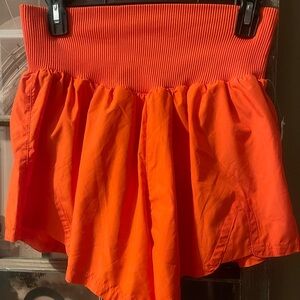 Free People Movement Vibrant Orange Carpe Diem shorts NWT
